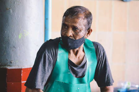 Male, Maldives - June 25, 2021: Local Maldivian Fisherman Working on the Central Market of Male Cityのeditorial素材