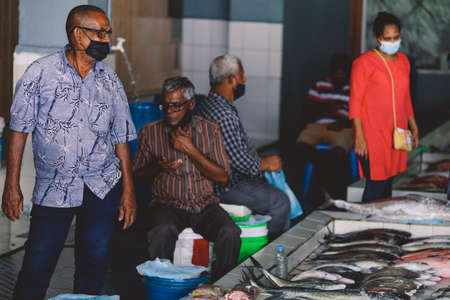 Male, Maldives - June 25, 2021: Local Maldivian Fisherman Working on the Central Market of Male City