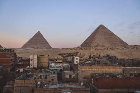 Beautiful View to the One of the Wonders of the Ancient World - Great Pyramids of Giza under Blue Sky and Day Lights of the Sun, Egyptの写真素材