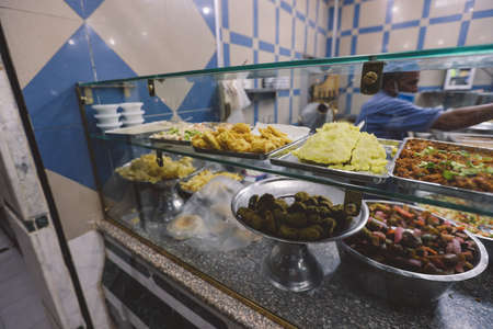 Giza, Egypt - November 02, 2021: Street Arabic Food with Eggs and Falafel in the city Center of Egyptian Gizaのeditorial素材