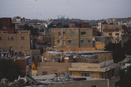 Sunset Cityscape View to the Giza City with the Colorful Sky and Local Buildings, Egyptの写真素材