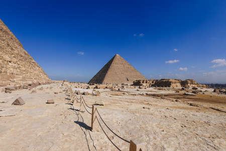 Natural View to the Great Pyramid of Giza under Blue Sky and Day Light - is the oldest and largest...