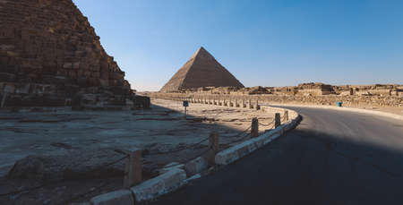Natural View to the Great Pyramid of Giza under Blue Sky and Day Light - is the oldest and largest...