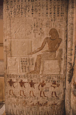 Cairo, Egypt - November 02, 2021: Interesting Ancient Paintings and Engravings with Hieroglyphics symbols in the Cairo Egyptian Museum, the oldest archaeological museum in the Middle Eastのeditorial素材