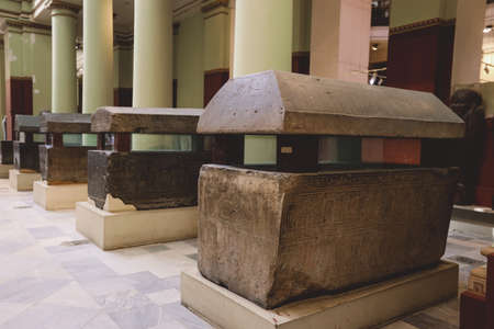 Cairo, Egypt - November 02, 2021: Majestic Ancient Sarcophagus with Hieroglyphics symbols in the...