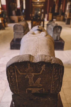 Cairo, Egypt - November 02, 2021: Majestic Ancient Sarcophagus with Hieroglyphics symbols in the...
