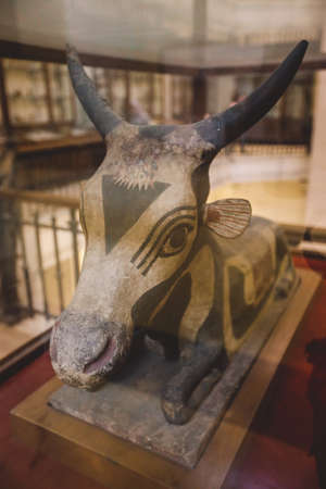 Cairo, Egypt - November 02, 2021: Stone Statue and Golden Painting of Ancient Egyptian Hathor...