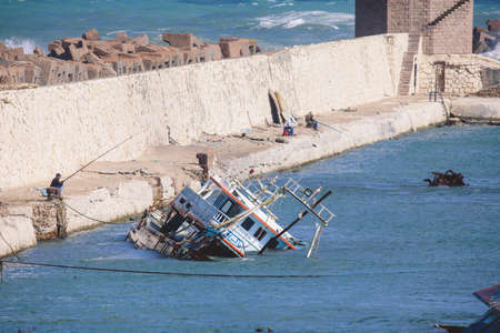 Old Rusted Boats in Blue Water of Alexandria Harbor, Egypt