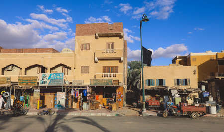 Siwa, Egypt - November 03, 2021: Cityscape View with Old Cars, Local People and Buildings in the Siwa Oasis between the Qattara Depression and the Great Sand Sea in the Western Desertのeditorial素材