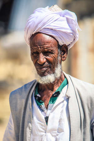 Keren, Eritrea - November 03, 2019: Local Eritrean Man in Traditional White dress on the Keren Camel animal Marketのeditorial素材
