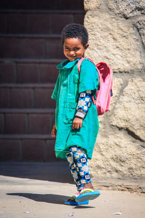 Keren, Eritrea - November 03, 2019: Nice and Cute Young Child in the Green School dressのeditorial素材