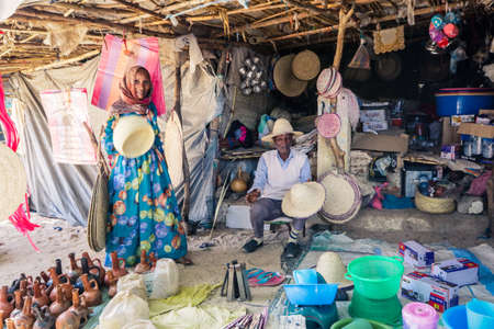 Keren, Eritrea - November 03, 2019: People on the Local Market with Kitchenware, Fruits and Vegetablesのeditorial素材