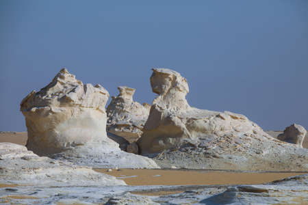 White Desert Sand Formations looks like two Sphinx in the Farafra Oasis, Egyptの写真素材