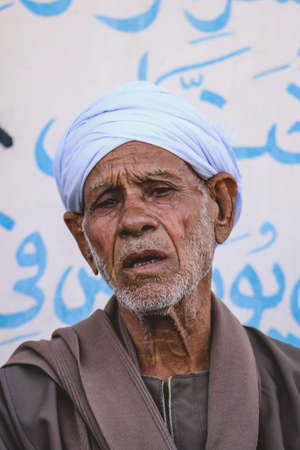 Luxor, Egypt - November 07, 2021: Close up Portrait of the Local Egyptian Old Man in Traditional Clothesのeditorial素材