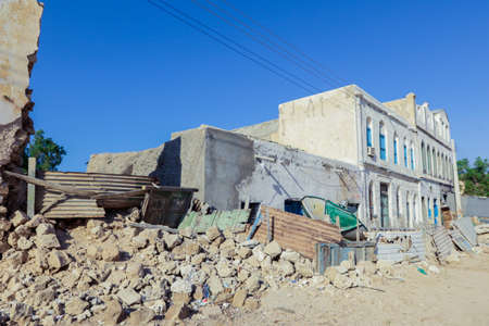 Berbera, Somaliland - November 10, 2019: Crushed Walls and Abandoned Buildings during War on the...