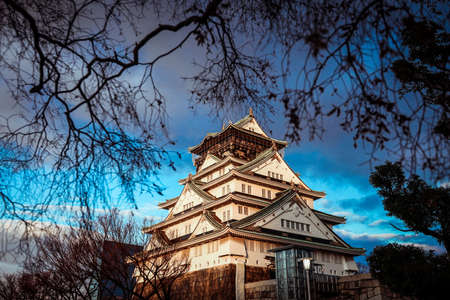 View to the Sunset Osaka Castle under Blue Sky and Trees, Japanのeditorial素材