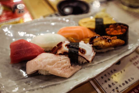 Osaka, Japan - January 08, 2020: Sushi on the Plate in the Osaka Sushi Belt Restaurantのeditorial素材