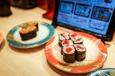 Osaka, Japan - January 08, 2020: Sushi on the Plate in the Osaka Sushi Belt Restaurantのeditorial素材