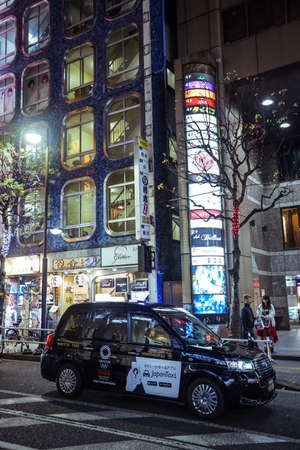 Tokyo, Japan - January 08, 2020: Japanese Cars and Taxi on the Illuminated Night Tokyo roadのeditorial素材