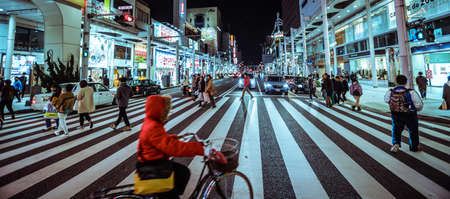 Himeji, Japan - January 14, 2020: Local People and Tourists are Crossing the Himeji main Road in the Night Timeのeditorial素材