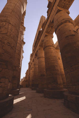 Luxor, Egypt - November 11, 2020: Ancient Massive Columns of Karnak Temple Complex in the Great Hypostyle Hall in the Precinct of Amun-Reの写真素材