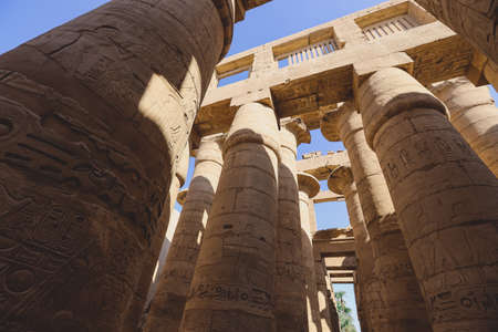 Luxor, Egypt - November 11, 2020: Ancient Massive Columns of Karnak Temple Complex in the Great Hypostyle Hall in the Precinct of Amun-Reの写真素材