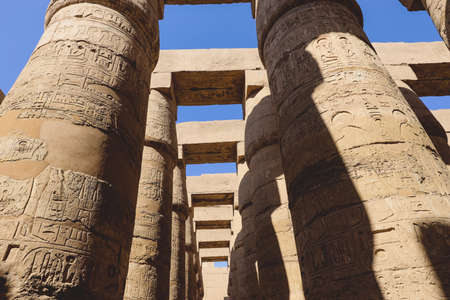 Luxor, Egypt - November 11, 2020: Ancient Massive Columns of Karnak Temple Complex in the Great...