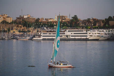 Egyptian Boat on the Nile River for Passengers transportation to Another Riverside in Luxor city,...