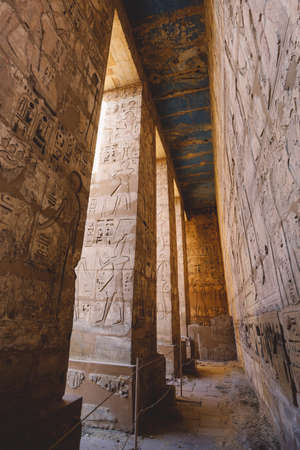 Ancient Egyptian Pillars of the Medinet Habu, Mortuary Temple of Ramesses III, near the Luxor, Egypt