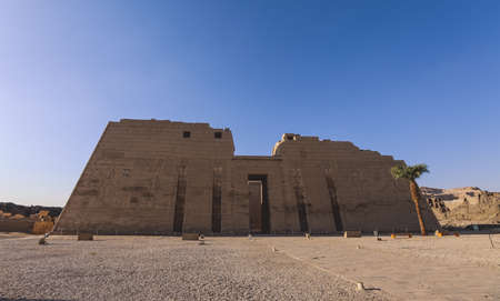 Main view to an Ancient Egyptian Medinet Habu, Mortuary Temple of Ramesses III, near the Luxor