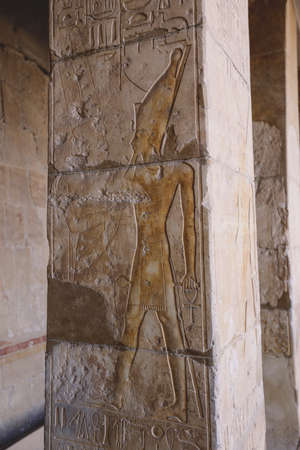 Luxor, Egypt - November 13, 2020: Ancient Egyptian Drawing on the Walls of Mortuary Temple of...