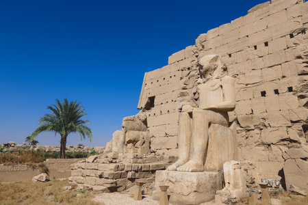 Ancient Sandstone Ruins of Old  Egyptian God in the Karnak Temple Complex near Luxor, Egypt