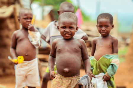 Larabanga, Ghana - August 25, 2016: African Children playing on the Larabanga Village Street