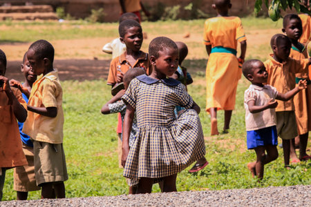 Kumasi, Ghana - April 04, 2022: African playing Children on the Village Streetのeditorial素材