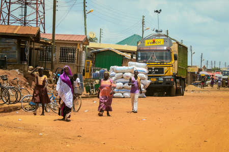 Accra, Ghana - April 06, 2022: Local African People doing daily job in Ghana Village, Western Africaの写真素材