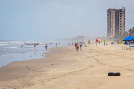 Accra, Ghana - April 06, 2022: Local African People having Fun on the Ghana Ocean Coastline