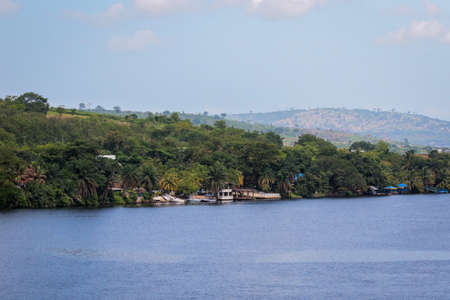 Amazing Natural Landscapes of Ghana Atlantic Ocean Coastline with Green Forest and Blue Water, West Africaの写真素材