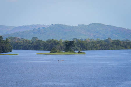 Amazing Natural Landscapes of Ghana Atlantic Ocean Coastline with Green Forest and Blue Water, West Africaの写真素材