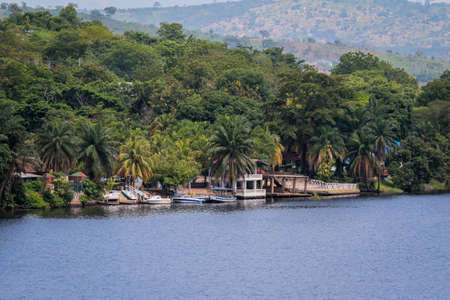 Amazing Natural Landscapes of Ghana Atlantic Ocean Coastline with Green Forest and Blue Water, West Africaの写真素材