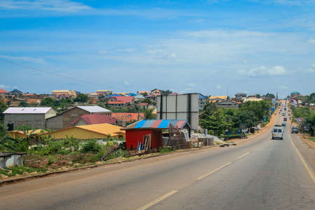 Scenic African Road under the Blue Sky in Ghana, West Africaの写真素材
