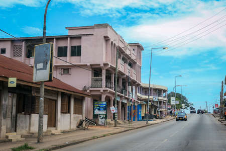 Kumasi, Ghana - April 06, 2022: Crowded African Road with Local Ghana People in Kumasi cityの写真素材
