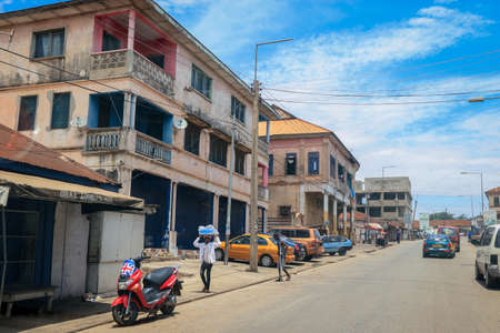 Kumasi, Ghana - April 06, 2022: Crowded African Road with Local Ghana People in Kumasi cityの写真素材