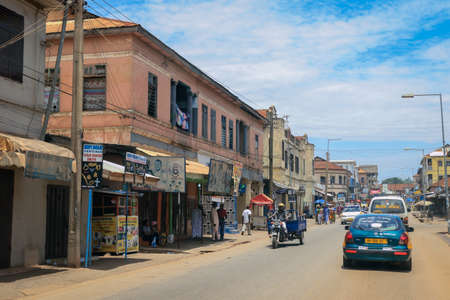 Kumasi, Ghana - April 06, 2022: Crowded African Road with Local Ghana People in Kumasi cityの写真素材