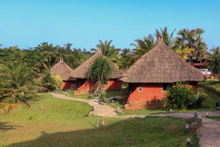 Traditional African Houses on the Axim Tropical Beach in Ghana, West Africaの写真素材