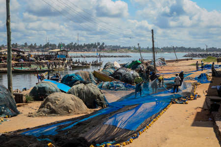 Atlantic Ocean View in the Elmina port with Boats and small Ships in Ghana, West Africaの写真素材