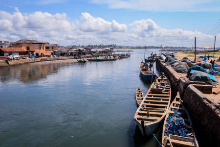 Atlantic Ocean View in the Elmina port with Boats and small Ships in Ghana, West Africaの写真素材