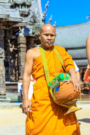 Pattaya, Thailand - June 21, 2022: One Man Monk in Yellow Dress in the Wooden Sanctuary of Truthのeditorial素材