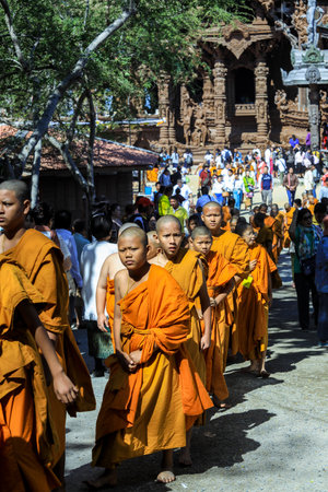Pattaya, Thailand - March 25, 2022: Ceremonial Procession of the Young Monks in the traditional Orange Dressing in the Sanctuary of Truthのeditorial素材