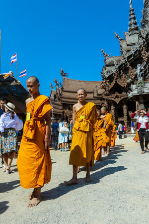 Pattaya, Thailand - March 25, 2022: Ceremonial Procession of the Young Monks in the traditional Orange Dressing in the Sanctuary of Truthのeditorial素材