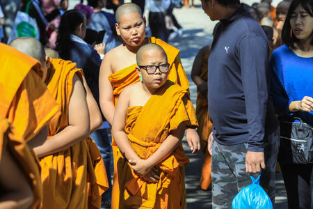 Pattaya, Thailand - March 25, 2022: Ceremonial Procession of the Young Monks in the traditional Orange Dressing in the Sanctuary of Truthのeditorial素材